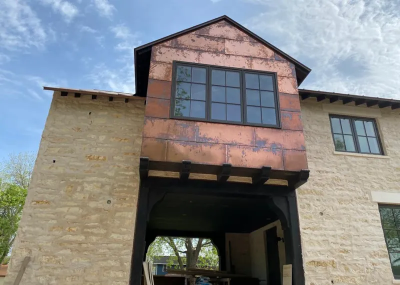 Copper metal panel facade on a stone building for Metal Roof Coating in South Monrovia Island